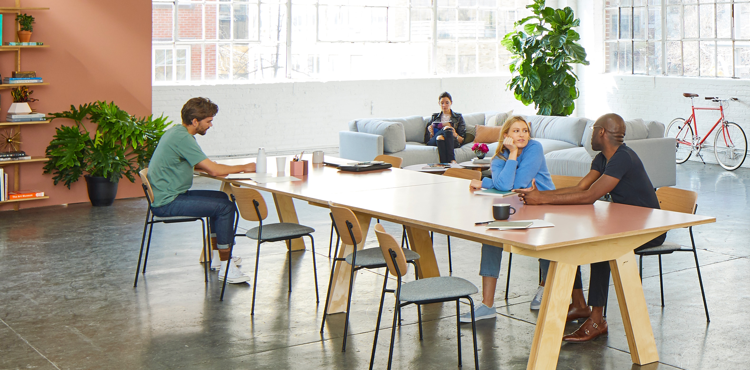 Comparison of stressed in-house team vs. efficient outsourced team highlighting the hidden cost of keeping everything in-house in 2025